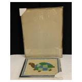 22X28 USED METAL FRAME WITH GLASS AND NEEDLEPOINT