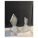 TWO PERFUME BOTTLES LEFT ON FLAKES ON STOPPER