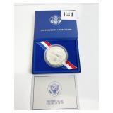 1986-P ELLIS ISLAND SILVER DOLLAR