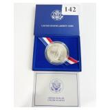 1986-P ELLIS ISLAND SILVER DOLLAR