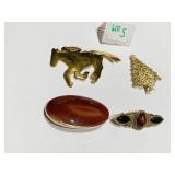 FOUR GOLD TONE PINS OVAL POLISHED AND AMBER STONE