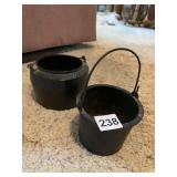 TWO CAST IRON POTS O LIDS # 0 ON FRONT OF 1