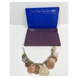 1983, 1985 PROOF SETS W/ FOREIGN COIN CHARM