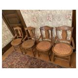 4 MATCHING CARVED BACK CHAIRS WITH WOVEN SEATS