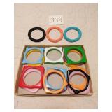 GROUP OF MOLDED PLASTIC AND BEADED BANGLE