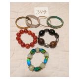 SEVEN BRACELETS 4 BANGLE 3 WITH LARGE BEADS ON