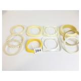 GROUP OF PLASTIC BANGLE BRACELETS CLEAR YELLOW