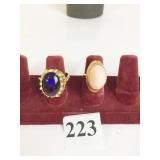 TWO RINGS SIZE 4 PURPLE STONE AND GOLD TONE WITH