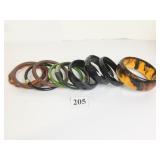 GROUP OF PLASTIC BANGLE BRACELETS BLACK FAUX