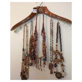 FIVE BOHO CARVED WOOD SAFARI ANIMAL AND BEADED