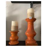 ORANGE CANDLE STANDS W/ CANDLES