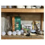 LIGHT BULBS AND GLASS HURRICANE GLOBES, ON SHELF