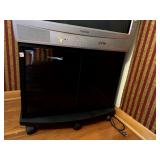 SMALL ROLLING TV STAND WITH ONE SHELF AND GLASS