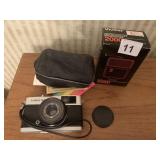 OLYMPUS TRIP 35 MM CAMERA AND VIVITAR 2000 FLASH