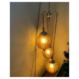 SWAG LAMP TRIO OF AMBER GLASS HANGING GLOBES, 3