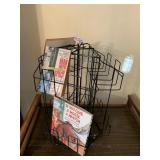 SPINNING BOOK DISPLAY RACK WITH A FEW KIDS BOOKS