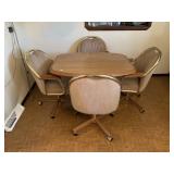 KITCHEN TABLE AND 4 UPHOLSTERED CHAIRS ON CASTERS