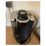 KEURIG THAT APPEARS UNUSED, WATER TANK STILL