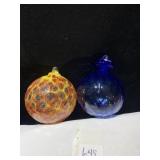 TWO KUGELS W/ HANGERS SIGNED BY BRIAN SUTHERLAND