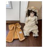 PORCELAIN DOLL W/ DRESS AND VELVET COAT