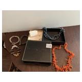 LEATHER BOX W/ CORAL AND BEADED NECKLACES