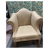 TAN ARMCHAIR W/ TACK STRIP EDGE WOOD LEGS