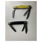 TWO BUCK KNIVES ONE YELLOW