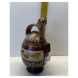 HAND PAINTED POTTERY PITCHER WITH CHEETAH HANDLE,
