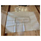 CUTOUT TABLECLOTH AND 6 UNUSED NAPKINS 51" X 68"