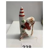 CERAMIC SANTA ON ROCKET CHRISTMAS ORNAMENT, MADE