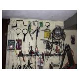 WALL OF HARDWARE, SCREW DRIVERS, OIL WRENCHES,