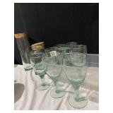 8 GREEN GLASSES AND 2 GREEN STORAGE CONTAINERS