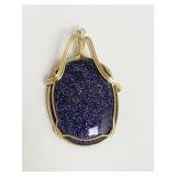 PURPLE GLITTERY STONE PENDANT IN GOLD TONE METAL