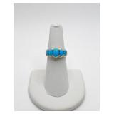 RING MARKED P10K WITH 5 BLUE OVAL STONES 3.6 G SZ