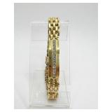 12 DIAMONDS ADORN THE CENTER OF THIS 18K GOLD 8"