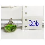 925 RING WITH LARGE GREEN CENTER STONE