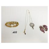 MONET GOLD TONE BRACELET BOW PIN WITH RED AND