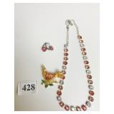 COREL BIRD PIN AND ORANGE AND CLEAR CRYSTAL