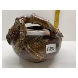 GLAZED POTTERY BOWL W/ ARM REACHING AROUND EDGE