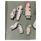 BISQUE DOLLS ON BROKEN ARM