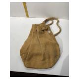 WOVEN STRAW DRAWSTRING BAG WITH LEATHER ACCENTS