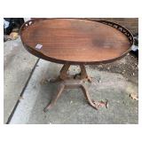 MAHOGANY OVAL TABLE W/ FRET WORK SIDES, CLAW FEET