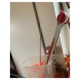 YARD RED STAKES AND RUBBERMAID CONTAINER