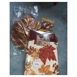 EASY CARE LEAF MOTIF TABLECLOTH AND LEAVES
