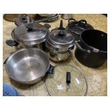ASSORTED STAINLESS STEEL PANS SOME WITH LIDS SOME