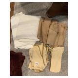 CREAM TABLECLOTHS WITH GOLD NAPKINS AND BUTTER