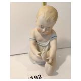 BISQUE BABY PLAYING W/ FOOT 6" H
