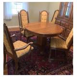TIGER OAK ROUND TABLE WITH 3 9 IN LEAVES
