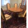 TIGER OAK ROUND TABLE WITH 3 9 IN LEAVES