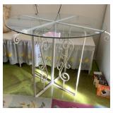 UNUSUAL IRON BASE GLASS TOP TABLE 40" W X 29" H